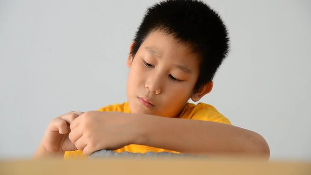 Asian boy playing clay at home 