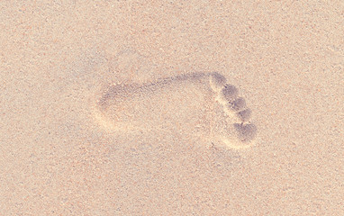 Footprint in the sand of the beach, Vintage style
