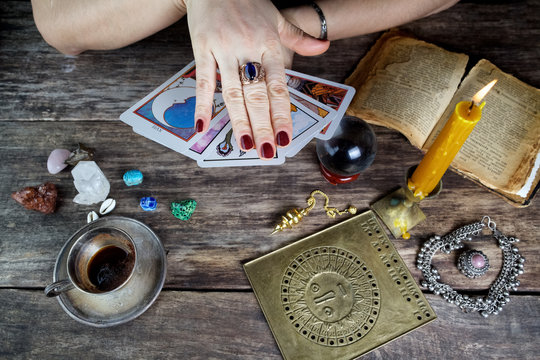 Fortune teller woman predicting future from cards