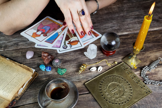 Fortune teller woman predicting future from cards