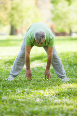Senior man is exercising in park. Active retirement.