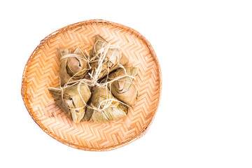 Bunch of Chinese rice dumpling placed on traditional rattan tray