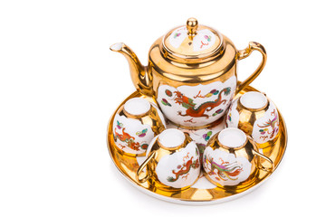 Generic traditional Chinese tea set with generic red envelope bearing the word double happiness, in white background