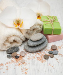 Obraz na płótnie Canvas Orchids, towel and handmade soap