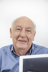 Old man using a Tablet