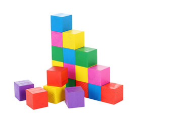 Colorful wooden toy cubes isolated on a white