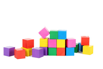 Colorful wooden toy cubes isolated on a white