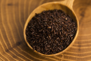 Psyllium seeds on wooden spoon