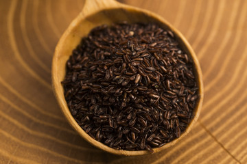 Psyllium seeds on wooden spoon