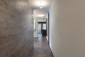 Interiors, long corridor with marble wall