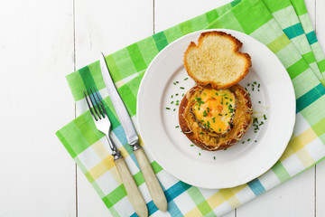 Baked sandwich with egg, cheese and ham.