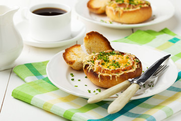 Baked sandwich with egg, cheese and ham.