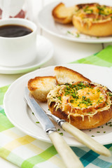 Baked sandwich with egg, cheese and ham.