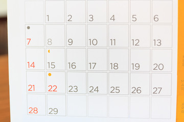 close up calendar page on table