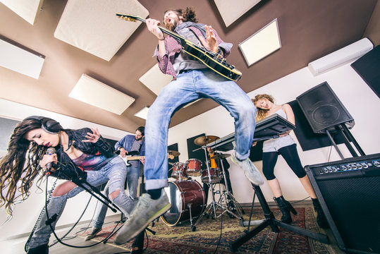 Rock band playing hard rock in the studio