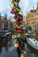 Amsterdam , the Netherlands - April 13, 2016: love padlocks Amsterdam canal scene