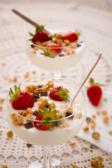 Dessert with strawberries cereals and chocolate flakes