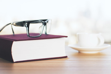 Closed book and glasses