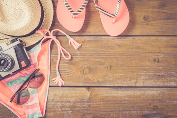 Beach accessories on an old yellow wooden table