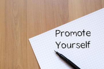 Promote yourself write on notebook