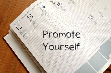 Promote yourself write on notebook