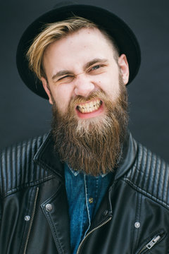 Hipster portrait of man in a studio