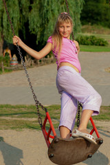 Girl riding on a swing