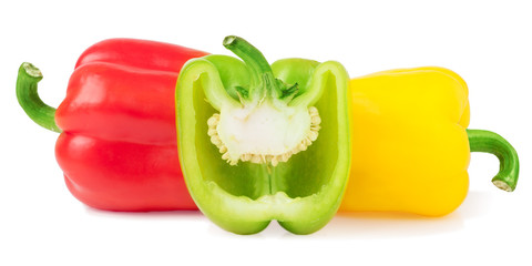 red green yellow bell peppers with half isolated on white