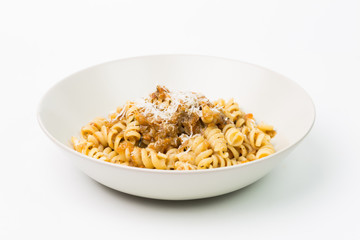 Pasta fusilli with braised meat sauce. Isolated on white backgro