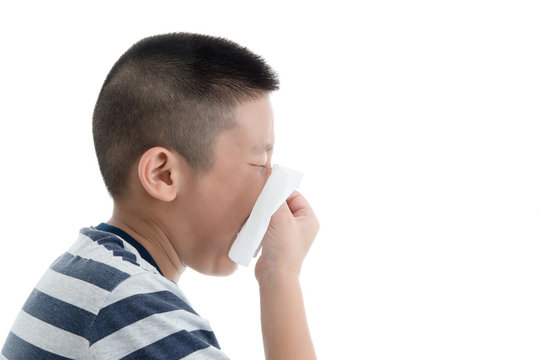 Flu cold or allergy symptom.Sick young asian boy with fever snee