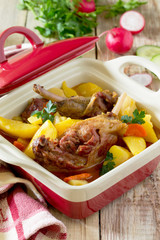 Roasted duck meat with boiled potatoes on a wooden table. Space