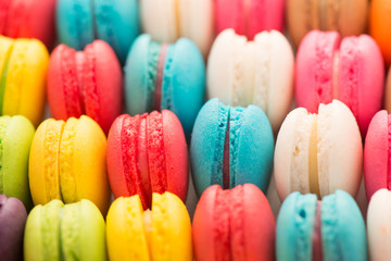 Colourful tasty macaroons in a row