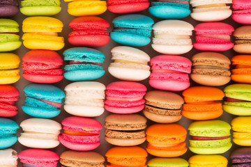 Colourful tasty macaroons in a row