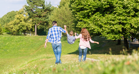 Family having walk holding hands