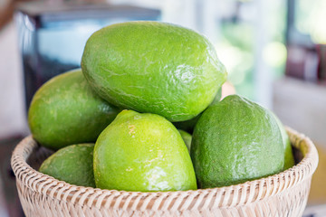 limes in Wooden bowl filled