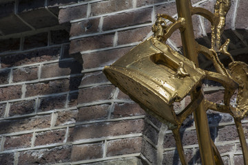 Golden iron on the brick wall