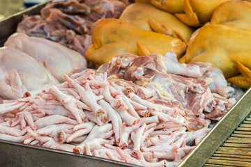 Chickens feet put it on the market for sale.