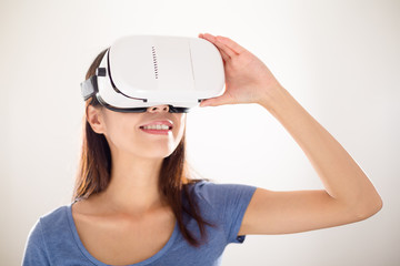 Asian woman using virtual reality device