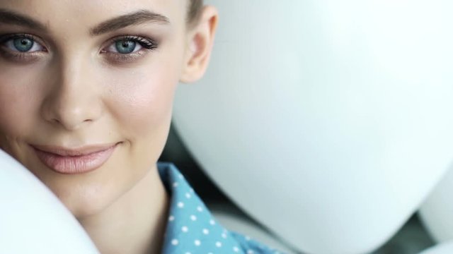 Professional fashion model looking and smiling into the camera
