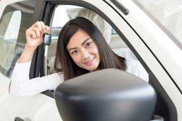 Young Happy Woman Showing The Key Of her New Car, Dream comes tr