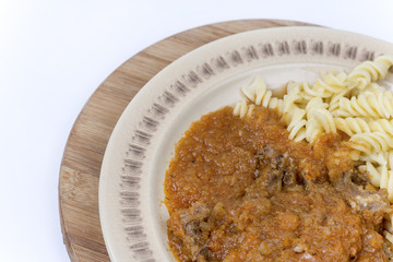 Meat goulash stew with pasta and copy space for advertising