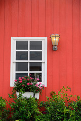 Old window on abandoned red barn