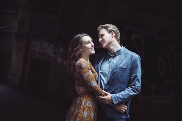 Young couple in love outdoor.  Man hugs  woman.