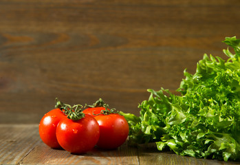 Fresh grape tomatoes with salad leaves