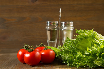 Fresh grape tomatoes with salad leaves