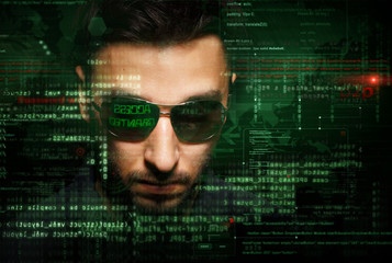 hacker at work with graphic user interface around