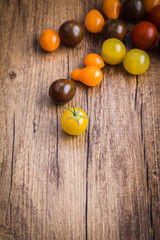Cherry tomatoes on a wooden background