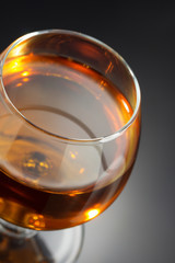 cognac and  glass  on black