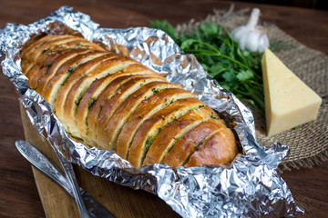 Baguette with garlic, cheese and herbs