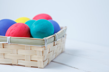 close up of colored easter eggs on wooden